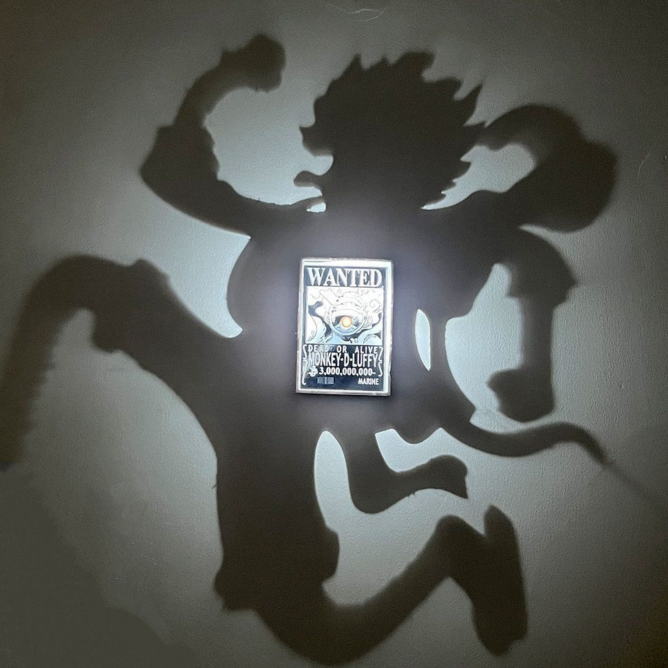 Luffy Gear 5 shadow lamp casting its silhouette on the wall