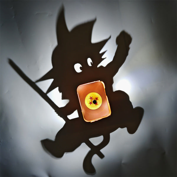 Kid Goku shadow lamp casting its silhouette on the wall