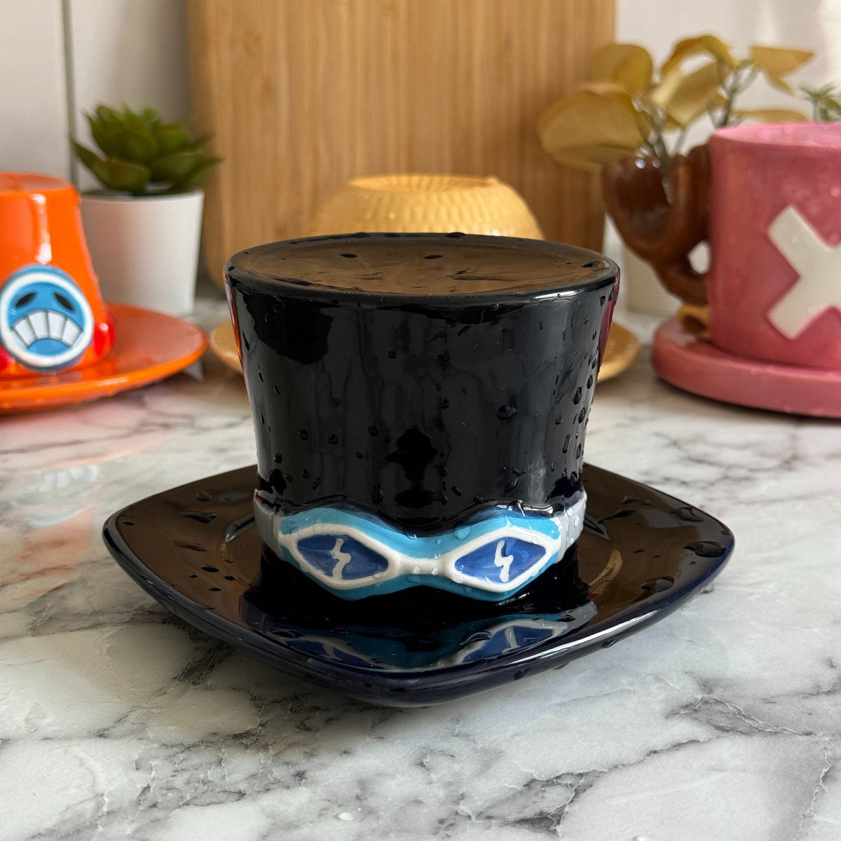 Sabo top hat mug, cup flipped onto its saucer