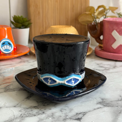 Sabo top hat mug, cup flipped onto its saucer